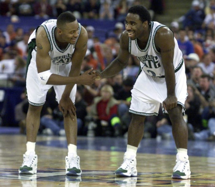 Michigan State Spartans guard Mateen Cleaves celebrates with a teammate.